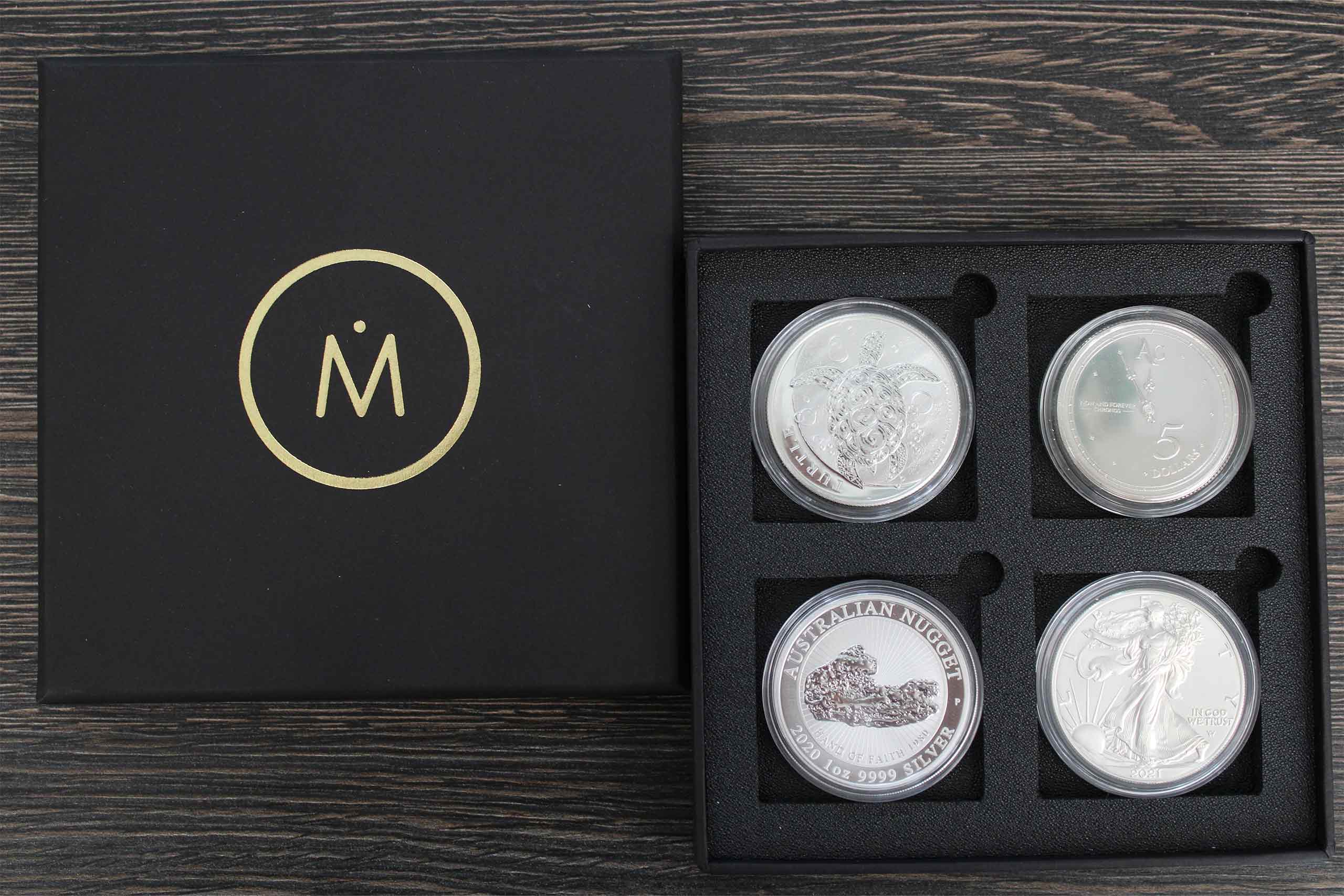Caja con 4 monedas de plata de Invermoneda, tienda online para la compra de bullion y lingotes de metales preciosos